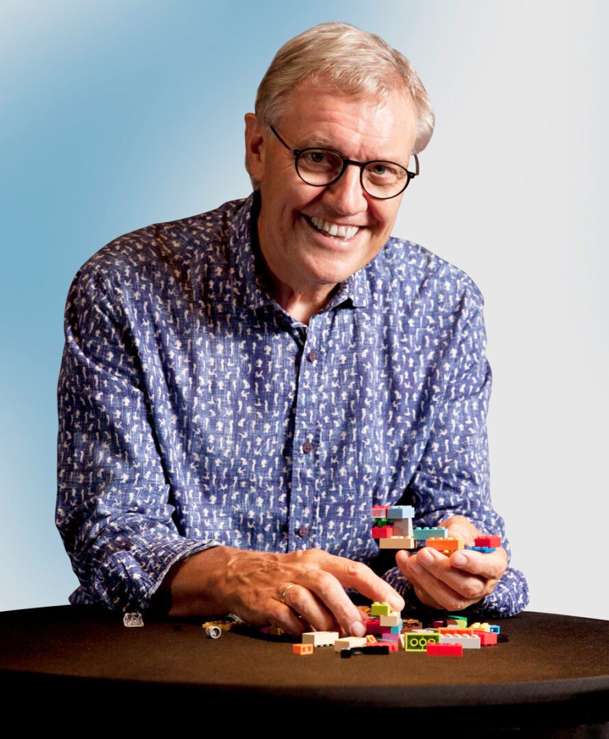 A man sitting at a table with some candy.