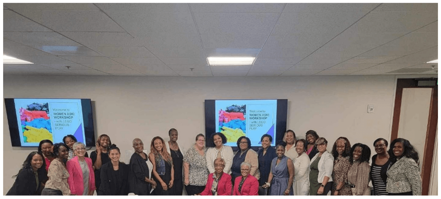 Diverse group of women posing at presentation